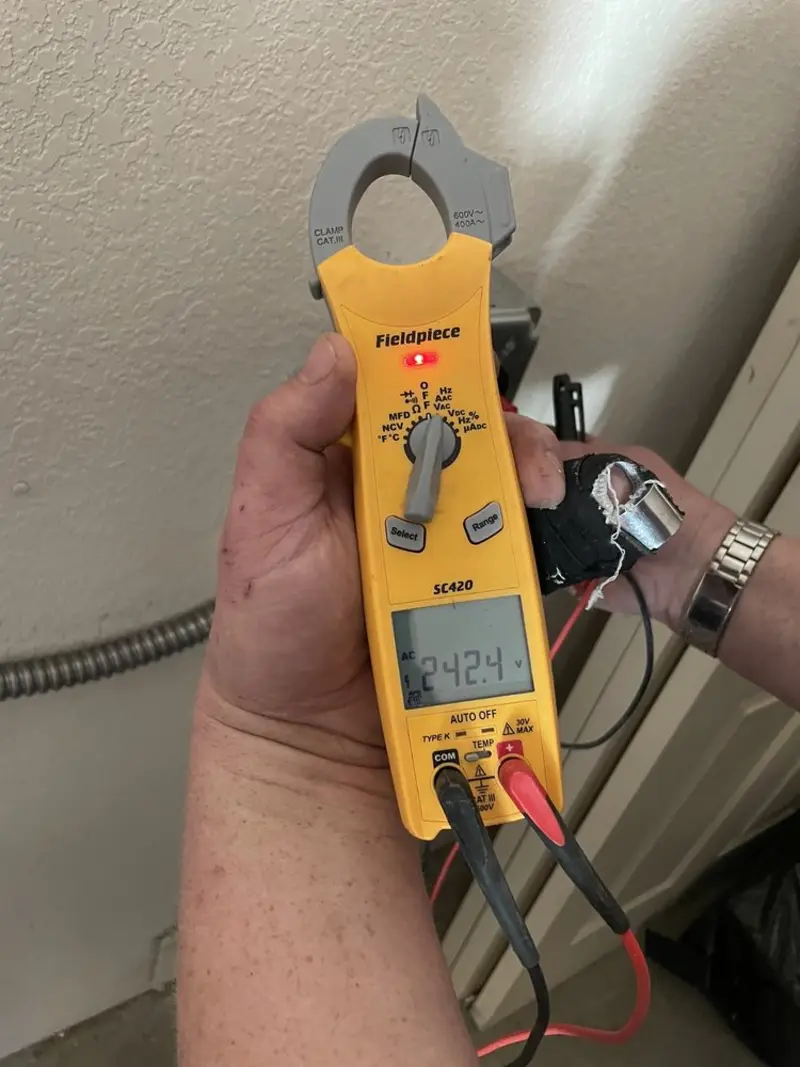Voltage testing with clamp meter during Circuit Breaker Repair in Blanchester
